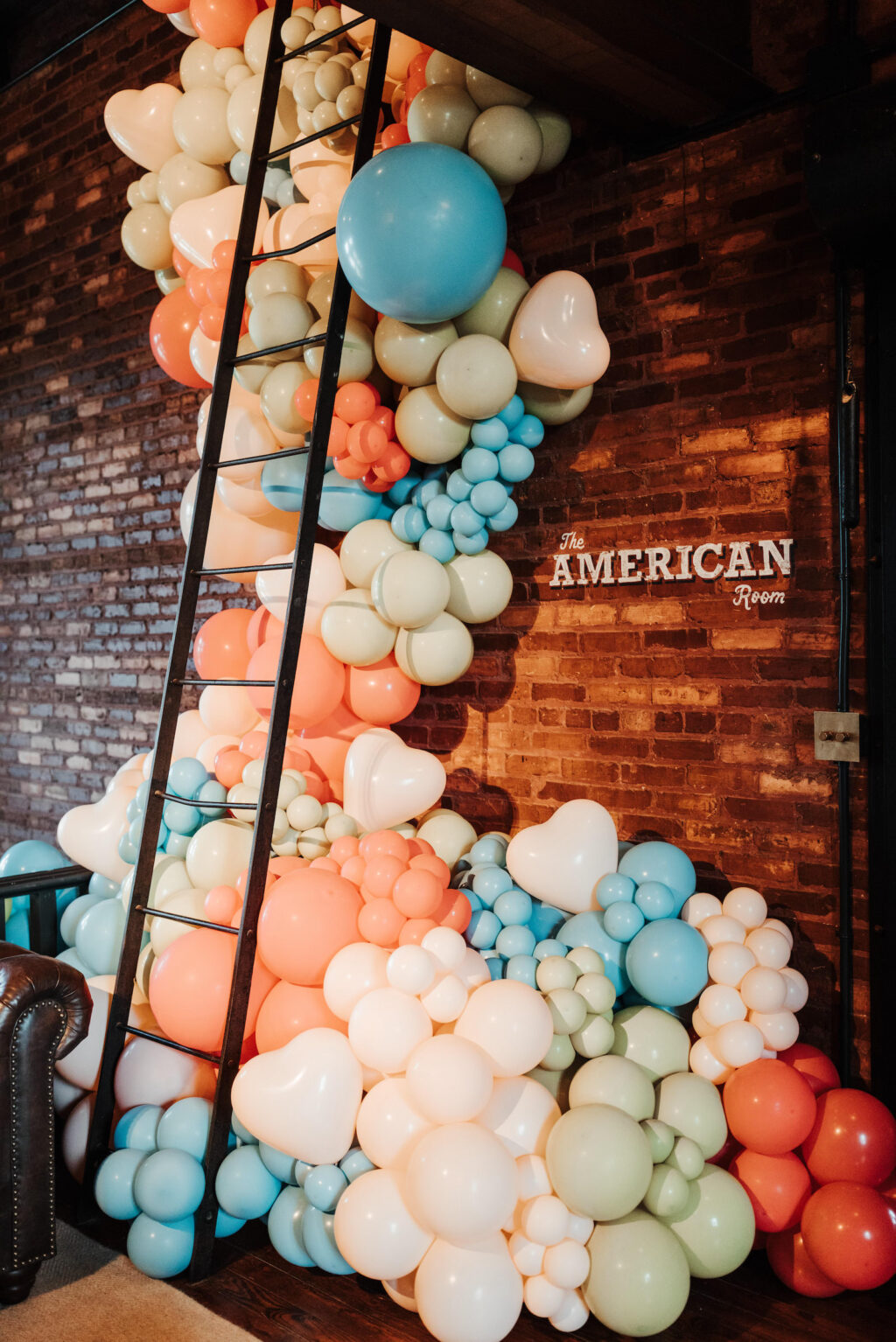 Whimsical Vibrant Blue, Green and Orange Balloon Wall Ideas for Industrial Wedding Venue | JC Newman Cigar Factory Tampa Florida Venue