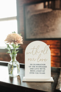 Decorative Wedding Ceremony Sign and Floral Décor