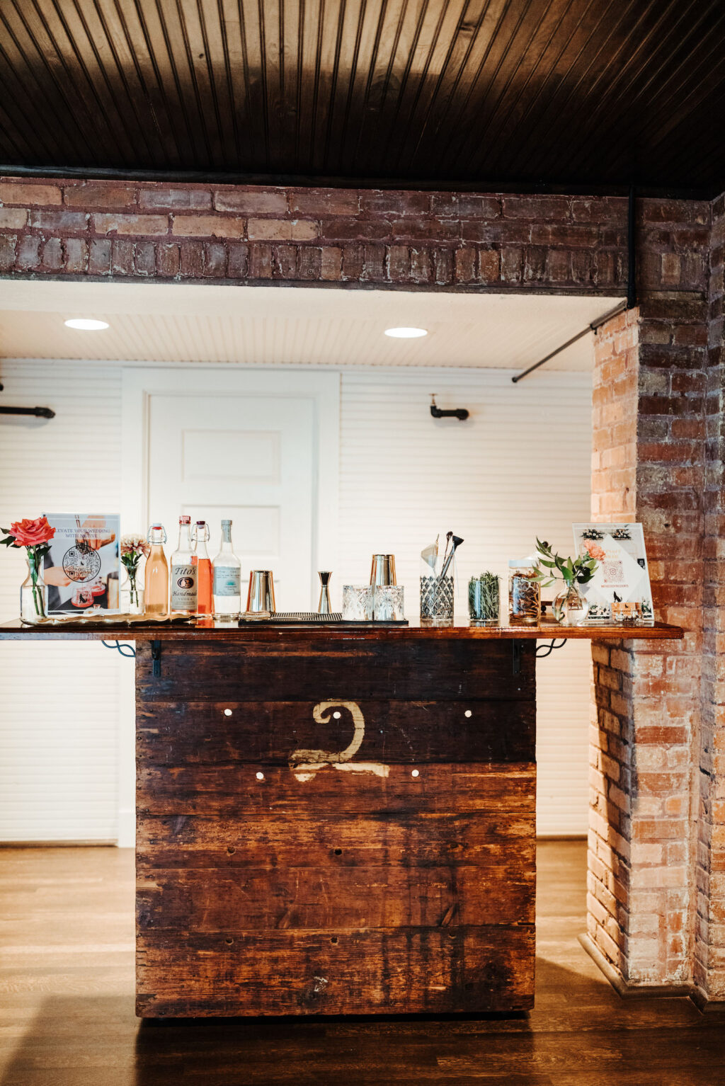 Wooden Wedding Bar Set Up in Industrial Wedding Reception | JC Neman Cigar Factory Tampa Bay Wedding Venue