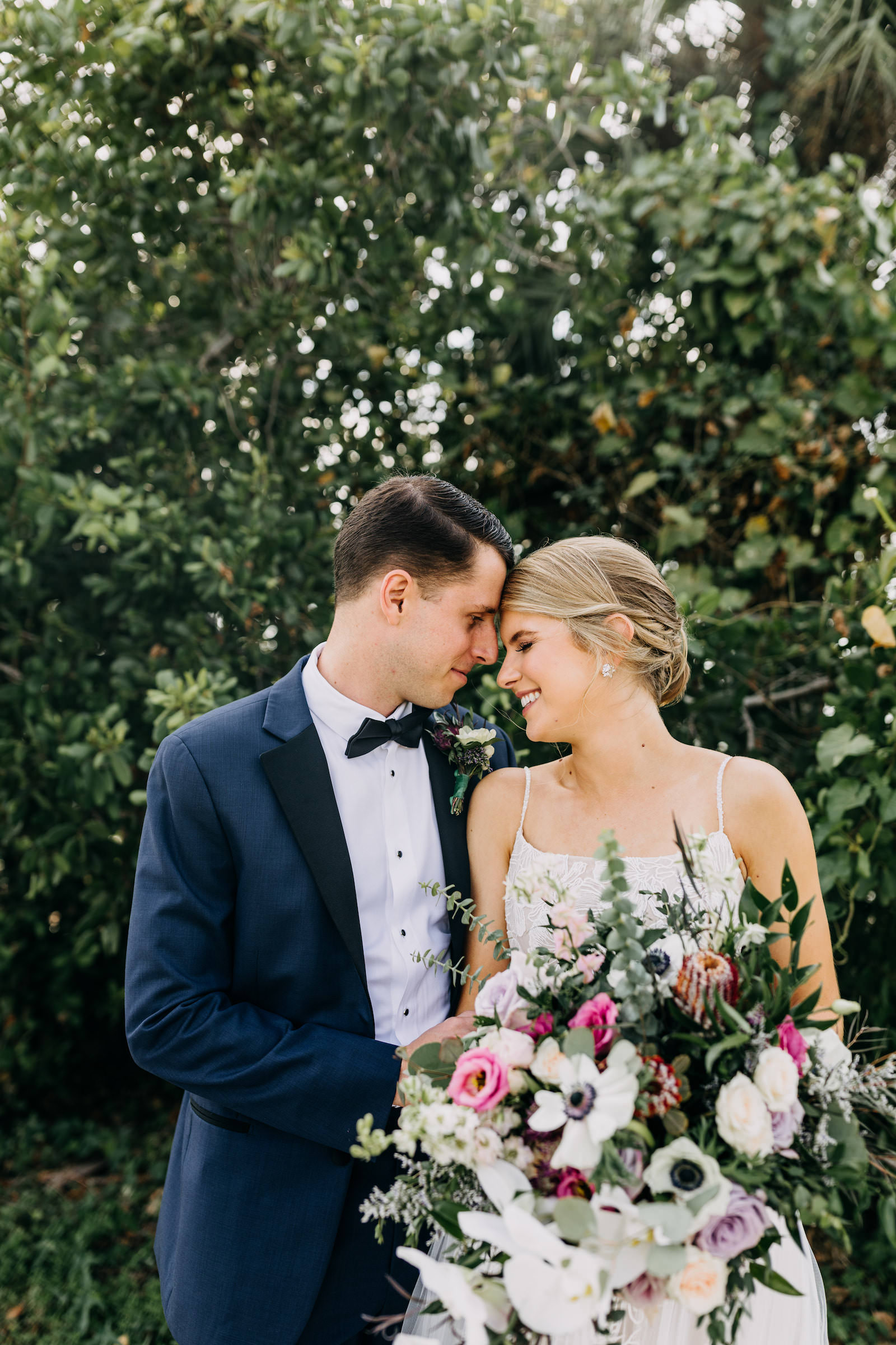 Florida Bride and Groom Wedding Portrait with Lush White Anemone, Pink and Lilac Roses and Greenery Floral Bouquet | Tampa Bay Wedding Photographer Amber McWhorter Photography | Wedding Florist Leaf It To Us