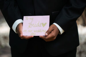 Groom Holding Letter for Bride Before the Wedding | Tampa Bay Wedding Photographer Limelight Photography
