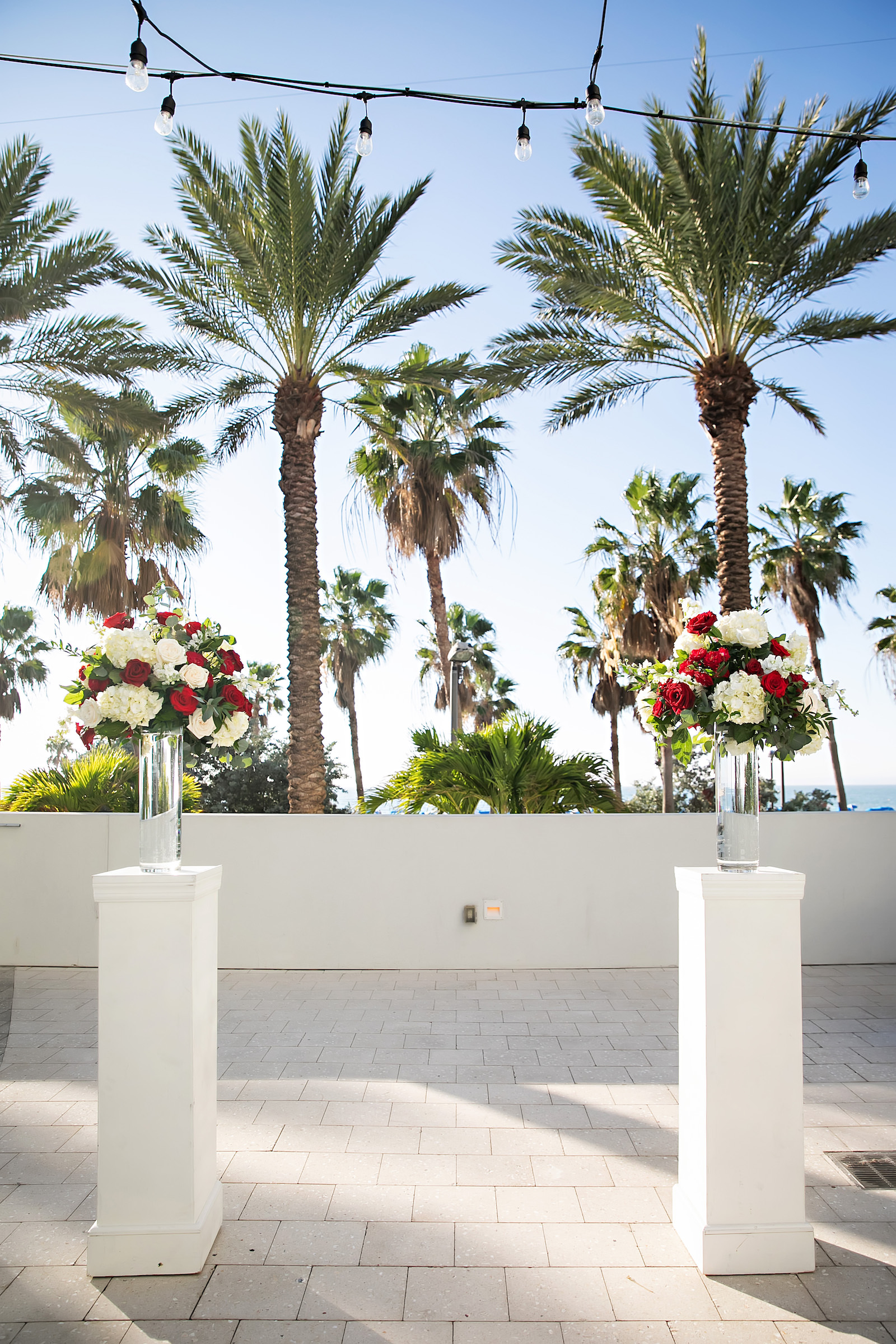 Outdoor Modern Wedding Ceremony Alter with Red and White Rose Bouquet | Florida Florist Save the Date Florida | Florida Wedding Venue Wyndham Grand Clearwater Beach