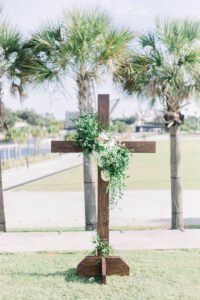 Wooden Cross Ceremony Detail with Floral and Greenery