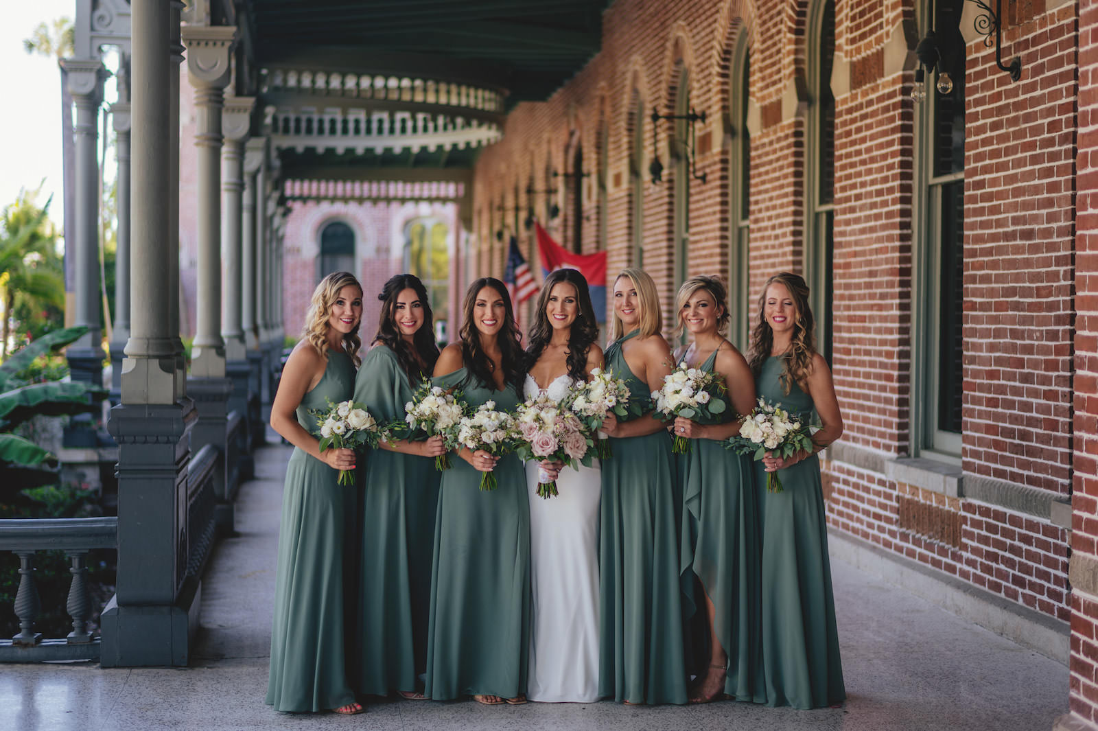 Modern Minimalist Bride and Bridesmaids Wearing Mix and Match Sage Green Dresses Holding White Floral and Greenery Bouquets | Tampa Bay Wedding Attire Bella Bridesmaids