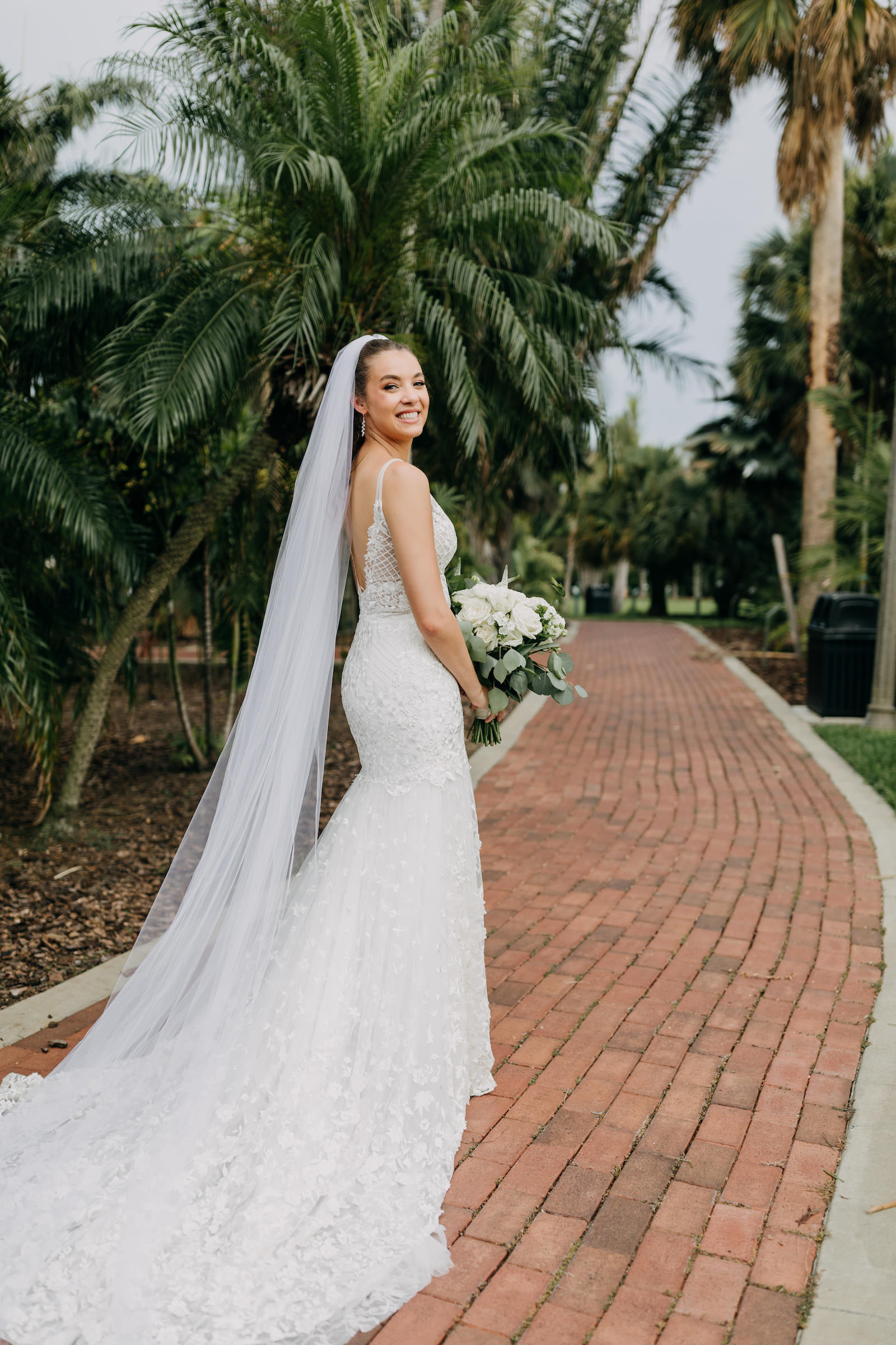 Bride in Embroidered Fitted V Back Wedding Dress and Long Train Veil Wedding Portrait | St. Pete Wedding Photographer Amber McWhorter Photography