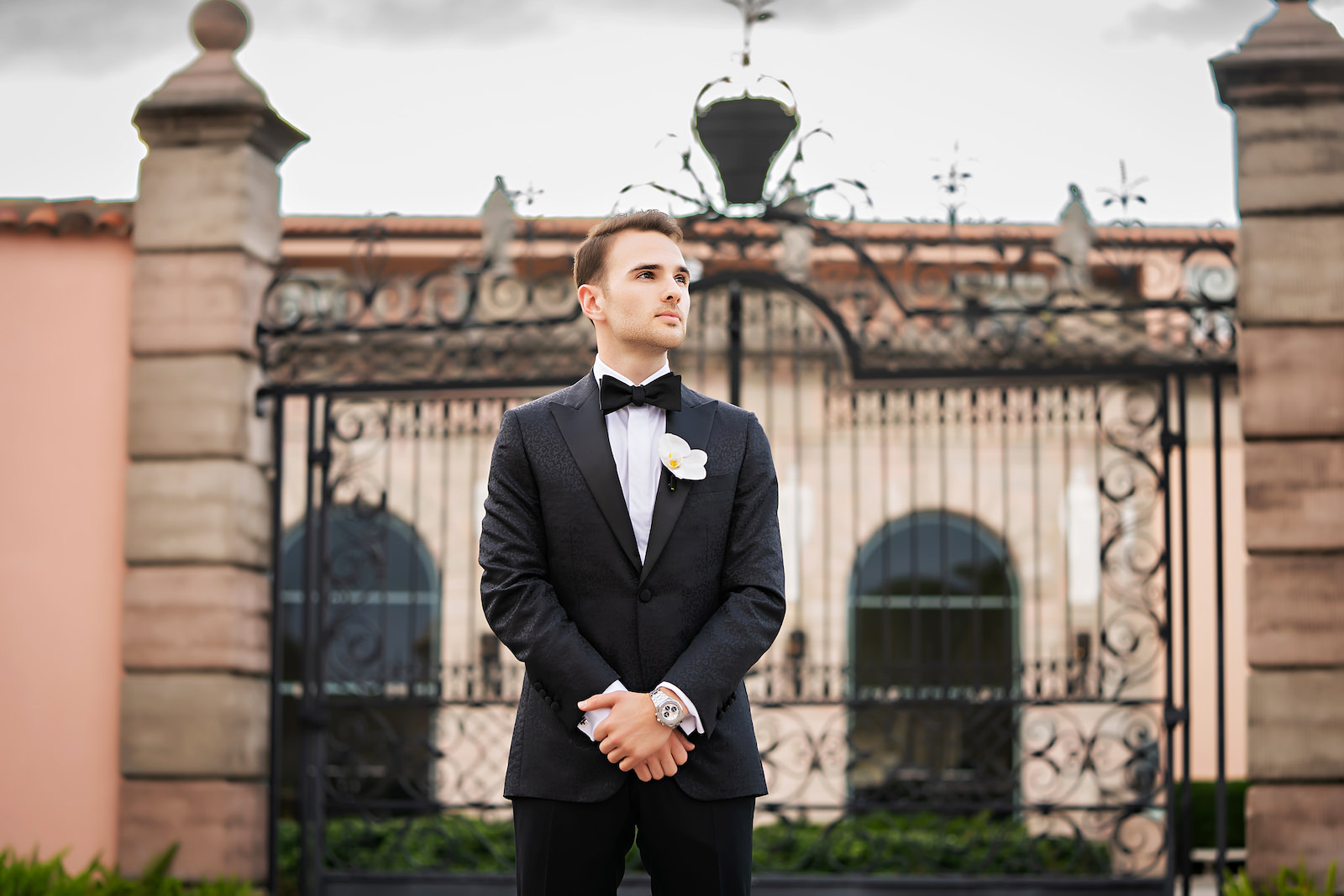 Luxurious Modern Groom Wearing Black Tuxedo and Bowtie | Tampa Bay Wedding Photographer Limelight Photography