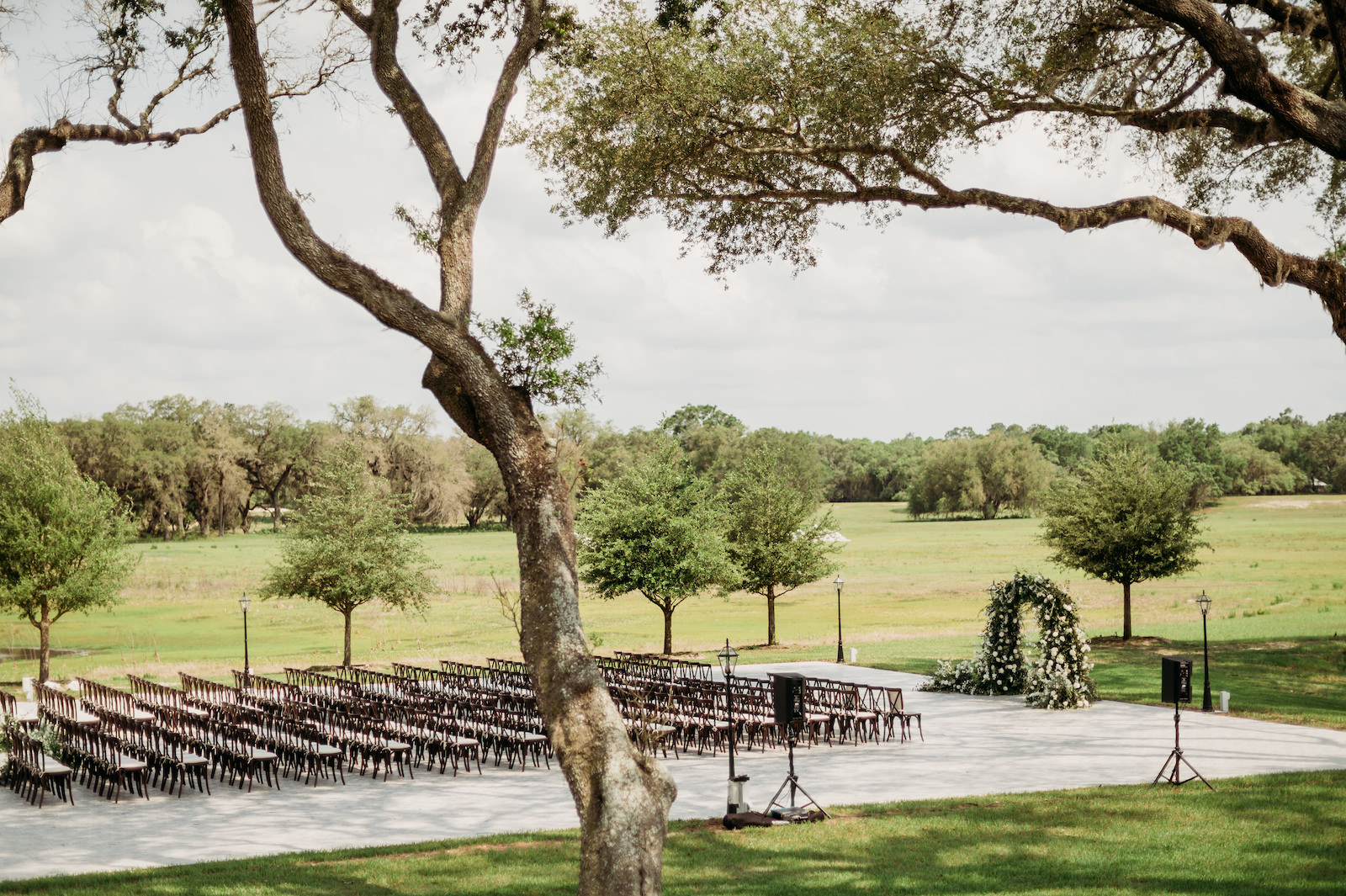 Classic Outdoor Wedding Ceremony Decor, Greenery and White Floral Arch | Tampa Bay Rustic Wedding Venue Simpson Lakes