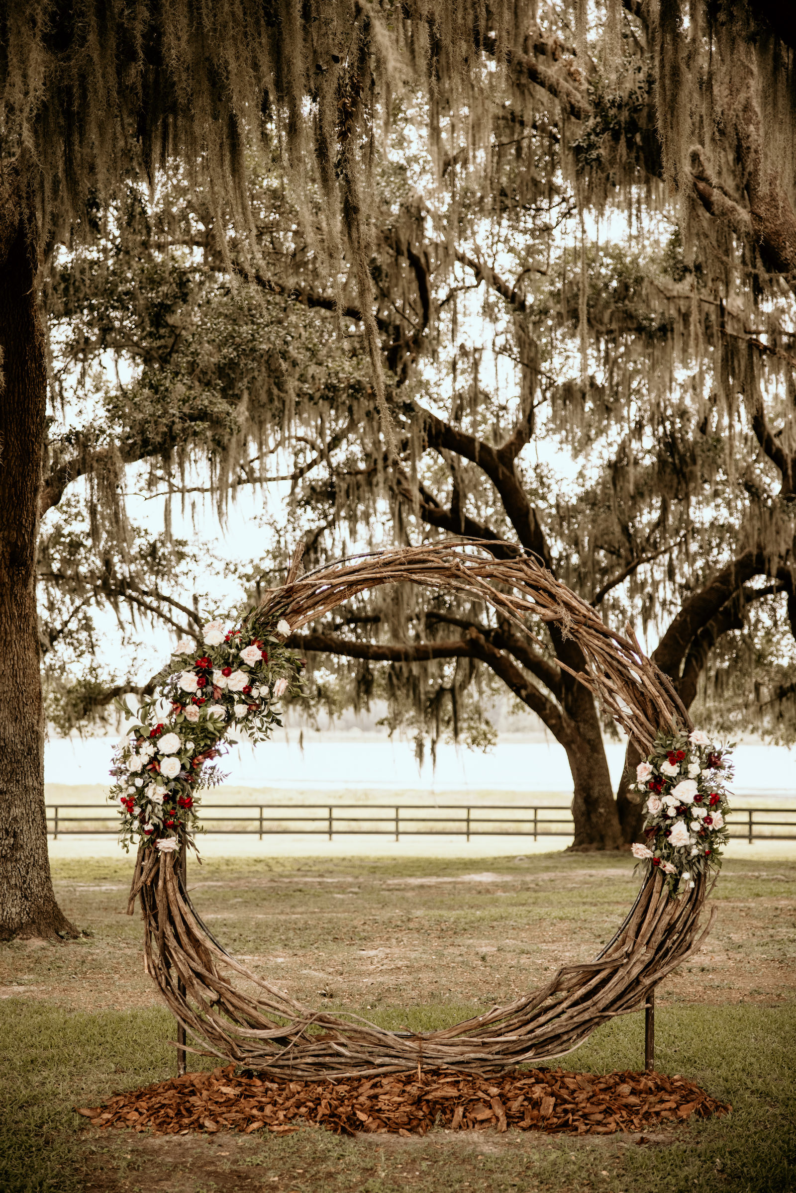 White Blush and Red Roses with Greenery Rustic Wedding Ceremony Arch