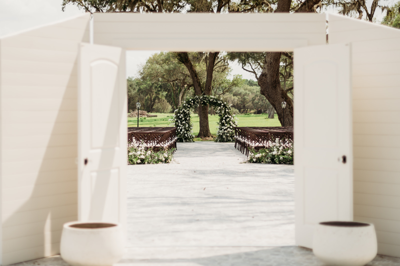 Classic Outdoor Wedding Ceremony Decor, White Doors, Greenery and White Floral Arch