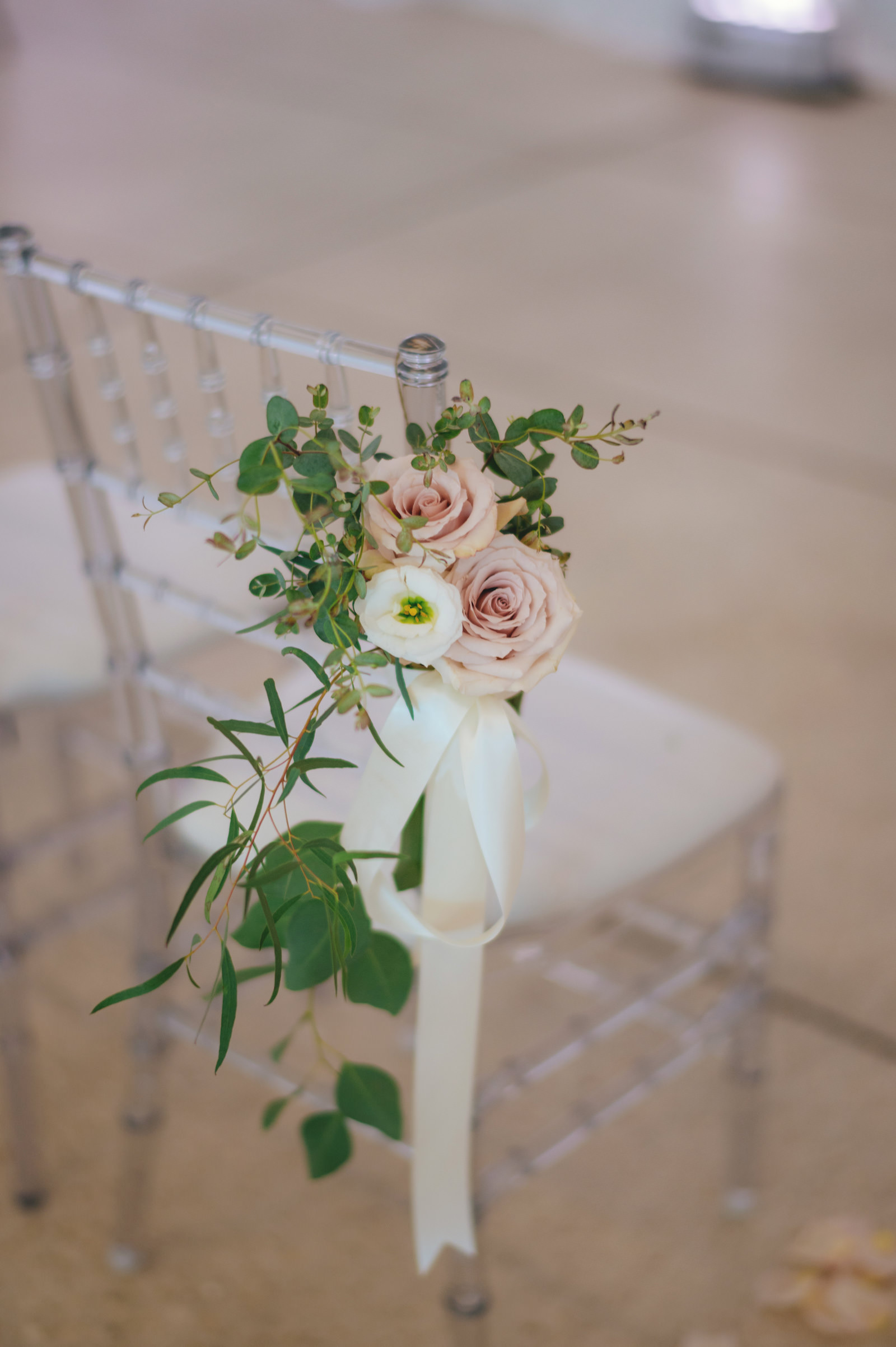 Modern Minimalist Wedding Ceremony Decor, Crystal Chiavari Chair with Blush Pink and White Rose with Greenery Floral Arrangement | Tampa Bay Wedding Chair Rental Kate Ryan Event Rentals