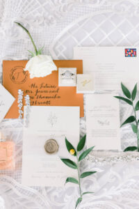 Burnt Orange Envelope with White Wedding Invitation with Gold Seal