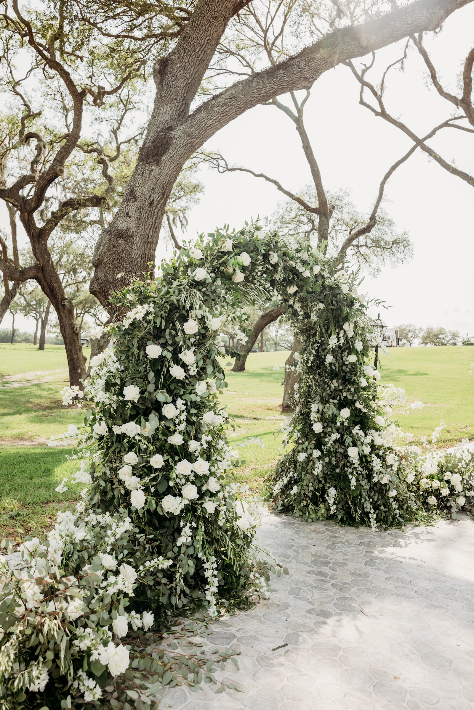 Classic Tampa Wedding Ceremony Decor, Lush Greenery and White Floral Arch