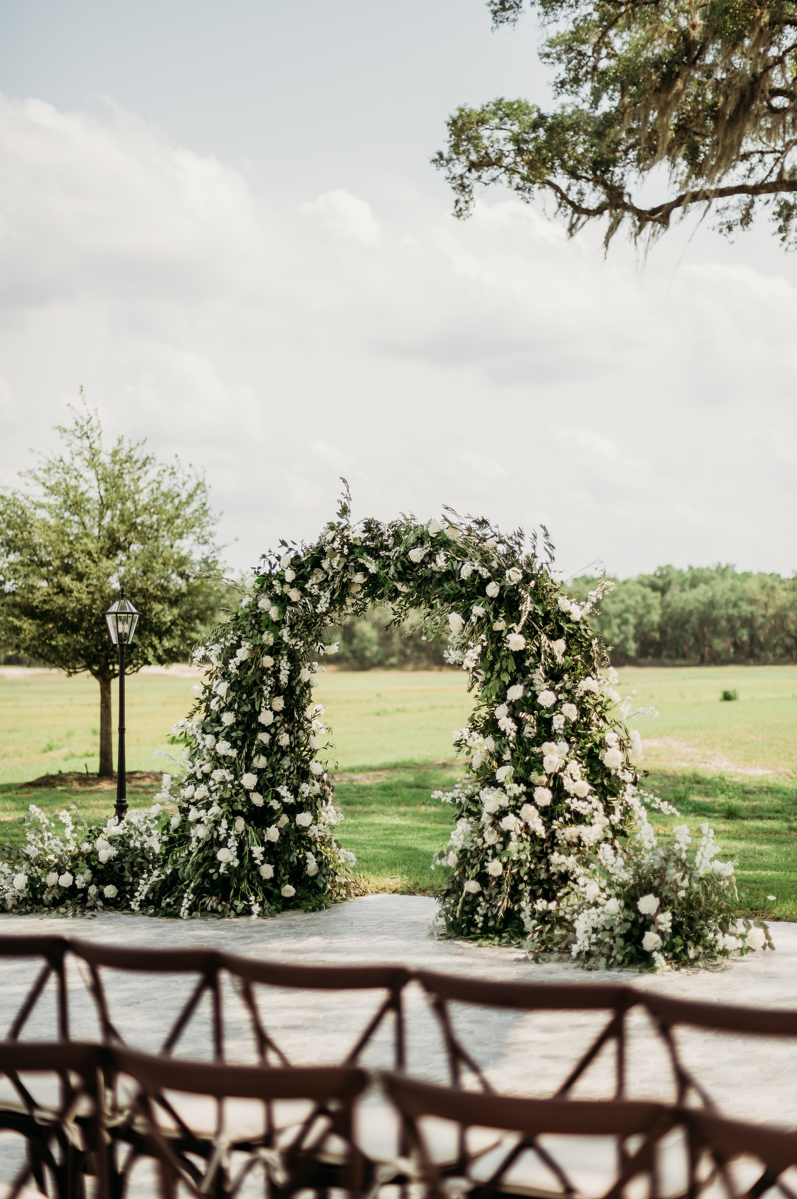 Classic Tampa Wedding Ceremony Decor, Lush Greenery and White Floral Arch