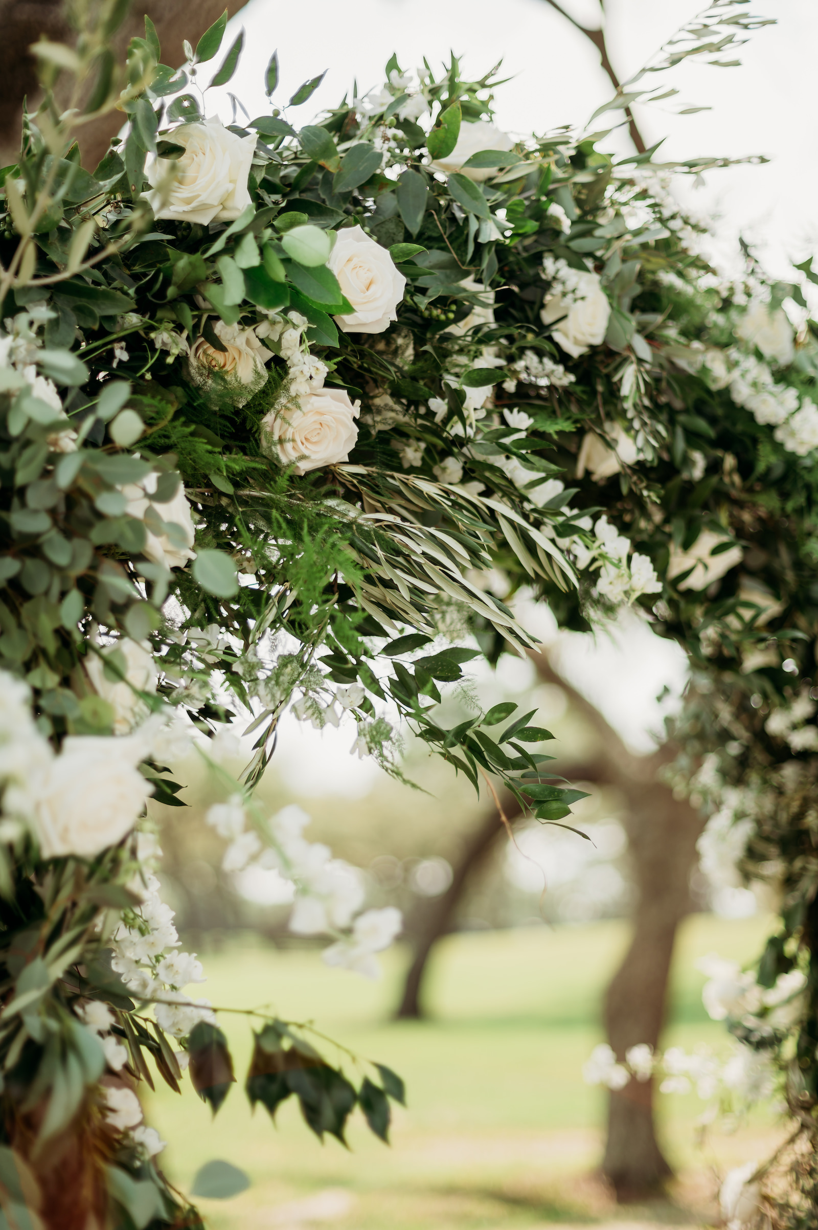 Classic Tampa Wedding Ceremony Decor, Lush Greenery and White Roses Floral Arch