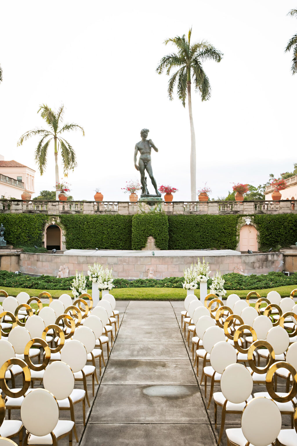Luxurious Modern Outdoor Courtyard Wedding Ceremony Decor, White and Gold Wedding Chairs | Tampa Bay Wedding Photographer | Sarasota Wedding Venue Ringling Museum
