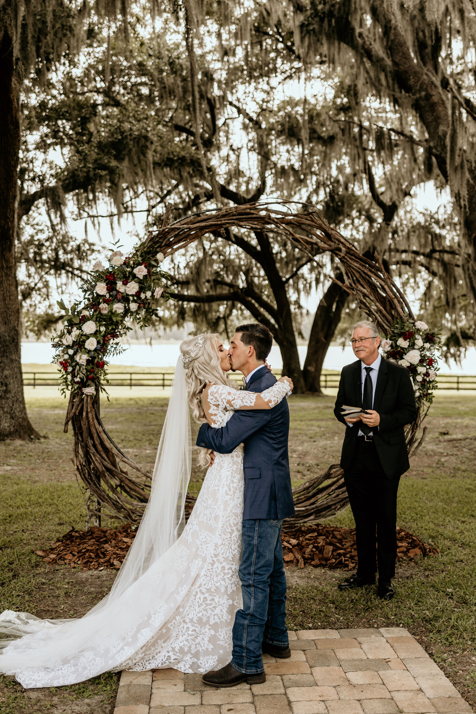 Bride and Groom First Kiss Wedding Ceremony Portrait | Tampa Wedding Venue Covington Farm