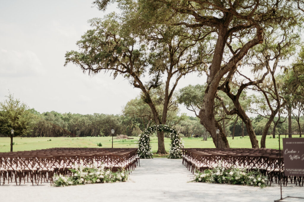 Classic Outdoor Wedding Ceremony Decor, Greenery and White Floral Arch | Tampa Bay Rustic Outdoor Wedding Venue Simpson Lakes