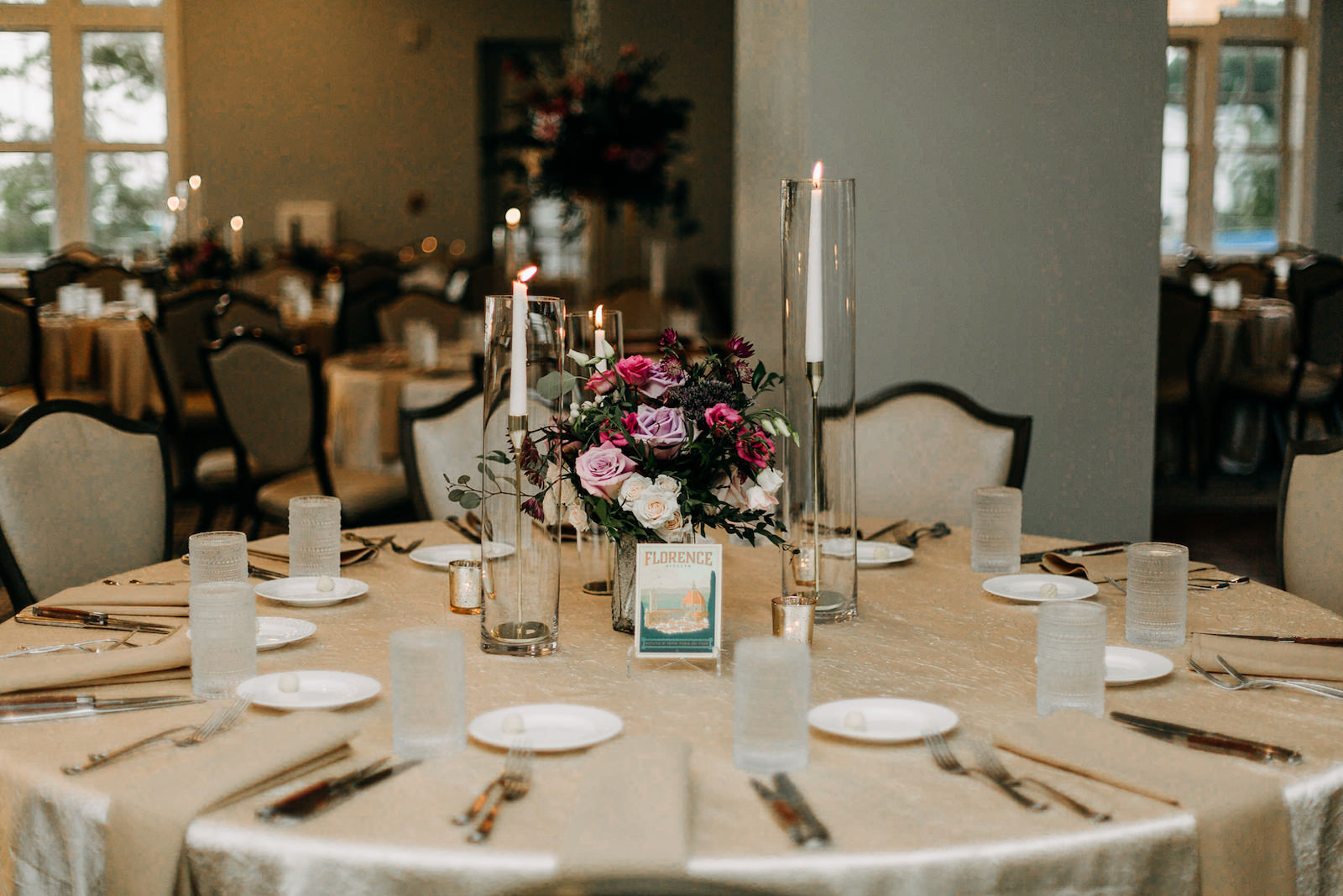 Tall White Candlesticks, Low Floral Centerpiece, Purple and Pink Roses with Greenery Flowers | Tampa Bay Wedding Florist Leaf It To Us | Wedding Photographer Amber McWhorter Photography