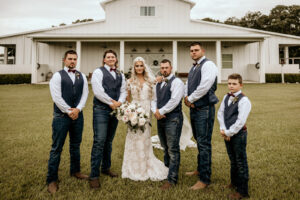 Bride with Groomsmen Wedding Portrait | Tampa Bay Wedding Venue Covington Farm