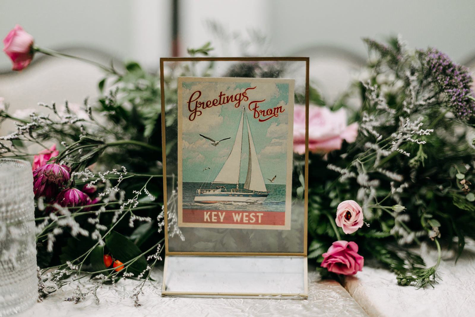 Florida Wedding Reception Decor, Vintage Key West Postcard in Gold Frame Unique Table Name | Tampa Bay Wedding Photographer Amber McWhorter Photography | Wedding Florist Leaf it To Us