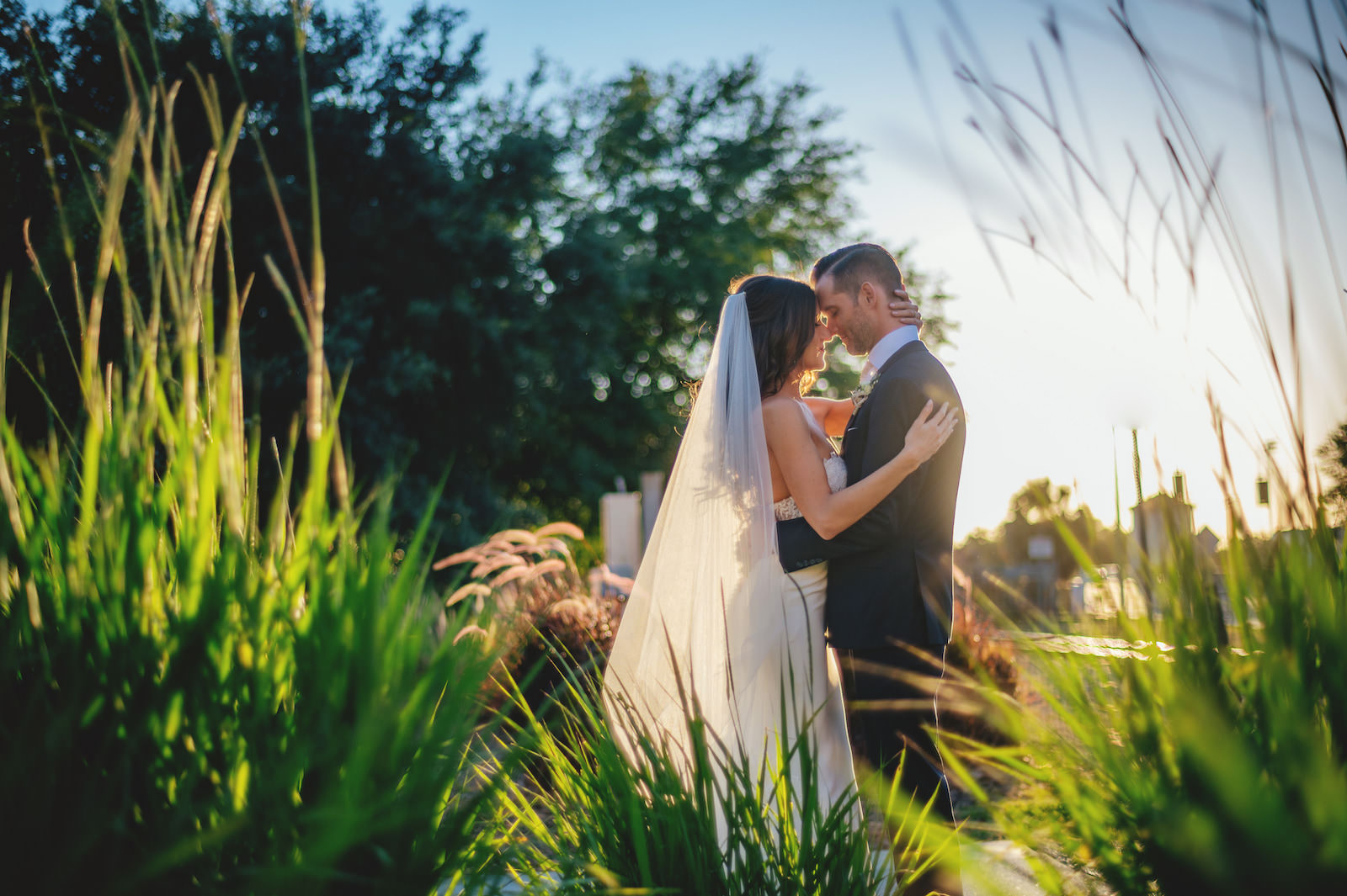 Romantic Sunset Wedding Photo of Bride and Groom in Garden