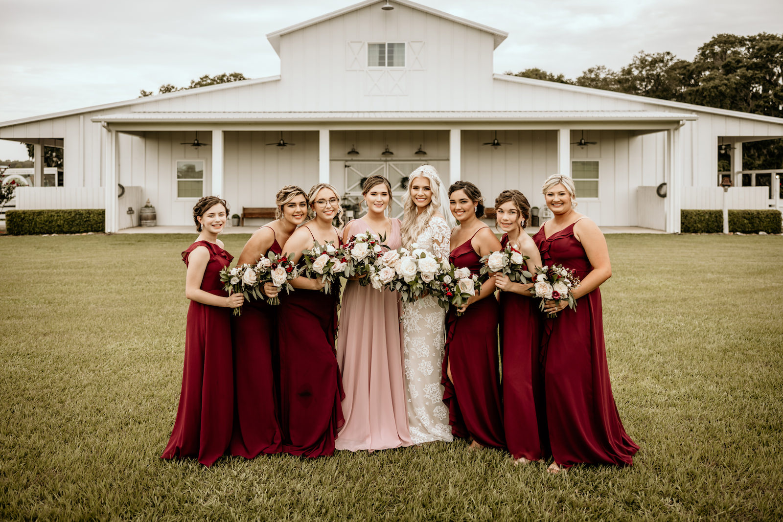 Burgundy and Blush Mix and Match Floor Length Bridesmaids Dresses with Blush White and Burgundy Rose Bouquets with Greenery | Covington Farm