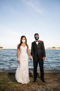 Bride and Groom Waterfront COVID Mask Portrait | Tampa Bay Wedding Photographer Limelight Photography