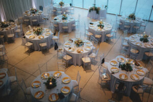 Modern Minimalist Wedding Reception Decor, Round Tables with Gold Chargers, Crystal Chiavari Chairs, Low Floral Centerpieces | Tampa Bay Wedding Chair Rentals Kate Ryan Event Rentals | Wedding Linen Rentals Over the Top Rental Linens
