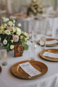 Modern Minimalist Wedding Reception Decor, Gold Chargers, White Menu Signage, White Table Linens | Tampa Bay Wedding Linen Rentals Over the Top Rental Linens