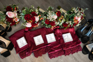 Elegant Garden Burgundy Wedding, Dark Red Lace Robes, Red and Blush Pink Roses, Greenery, White Flowers and Berries Floral Bouquets | Tampa Bay Wedding Photographer Limelight Photography | Wedding Florist Lemon Drops