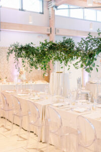 Ghost Chairs with White Linens and Tall Gold Greenery Centerpieces Wedding Tablescape | Tampa Florida Rental Company Kate Ryan Event Rentals