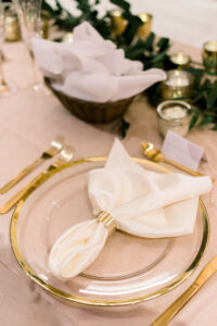 White Napkins and Clear and Gold Chargers | Kate Ryan Event Rentals | Tampa Caterer Elite Events Catering