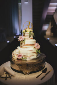 Modern Minimalist Semi Naked Three Tier Wedding Cake with Blush Pink Roses and White Roses and Laser Cut Monogram Cake Topper