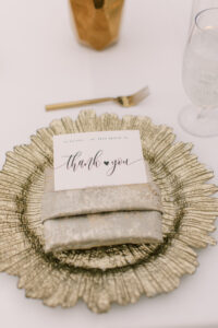 Vibrant Boho Wedding Reception Decor, Gold Reef Charger with Linen Napkin and Black and White Stationery