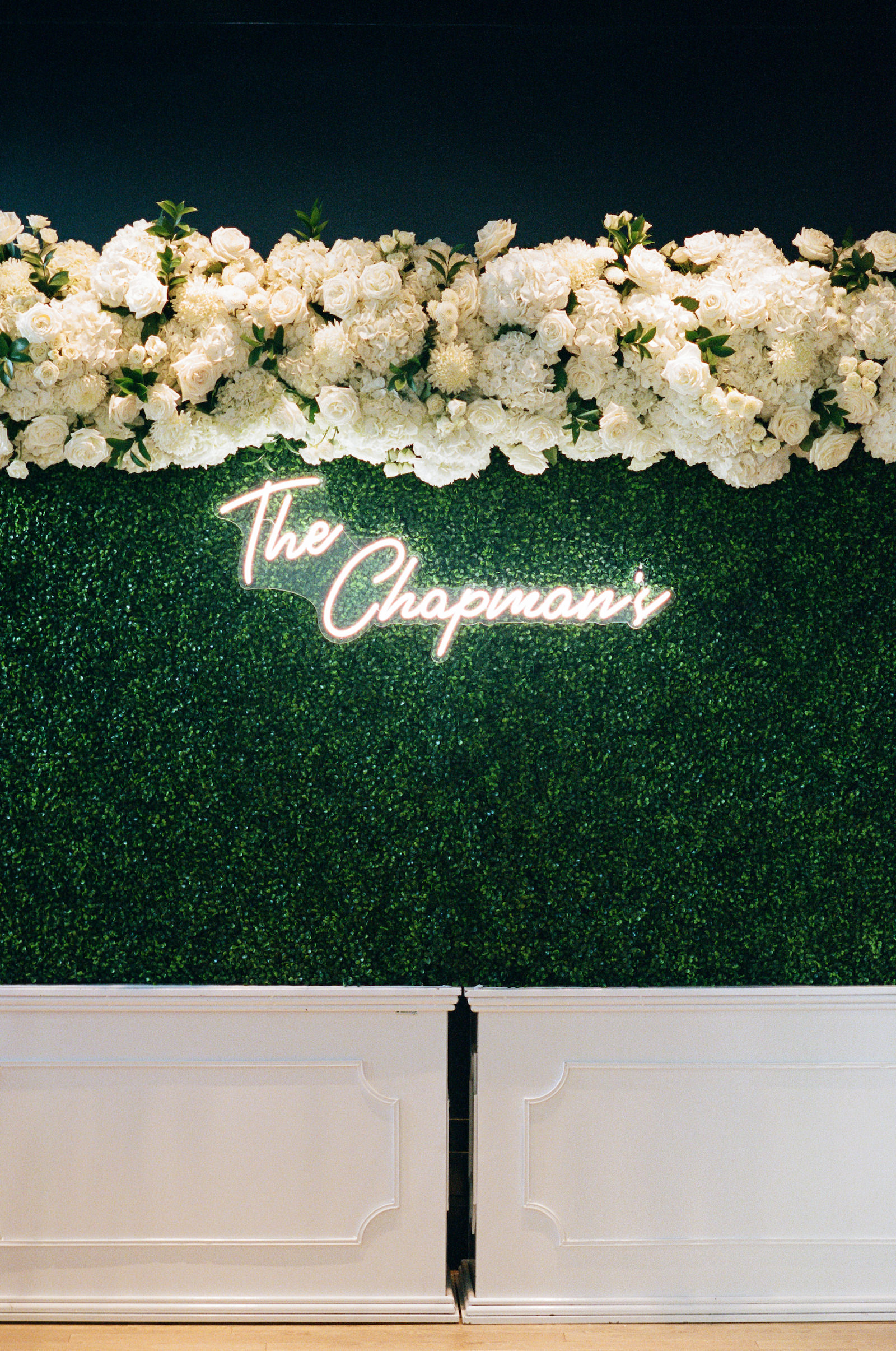 Luxurious Formal Wedding Reception Decor, Greenery Wall with Custom Neon Sign, All White Lush Flowers Hanging | Tampa Bay Wedding Florist Bruce Wayne Florals | Wedding Planner Parties A'la Carte | Wedding Rentals Gabro Event Services
