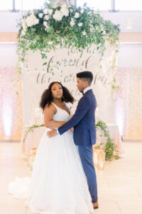 Bride and Groom in Front of Sweetheart Table Tampa Reception Portrait | Kate Ryan Event Rentals