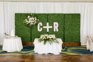 Sweetheart Table with Greenery Wall, White Linen, and Initials Signs | Tampa Wedding Rentals Gabro Event Services