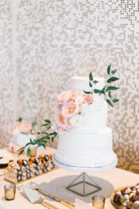 Three Tier White Wedding Cake with Pink Florals and Greenery