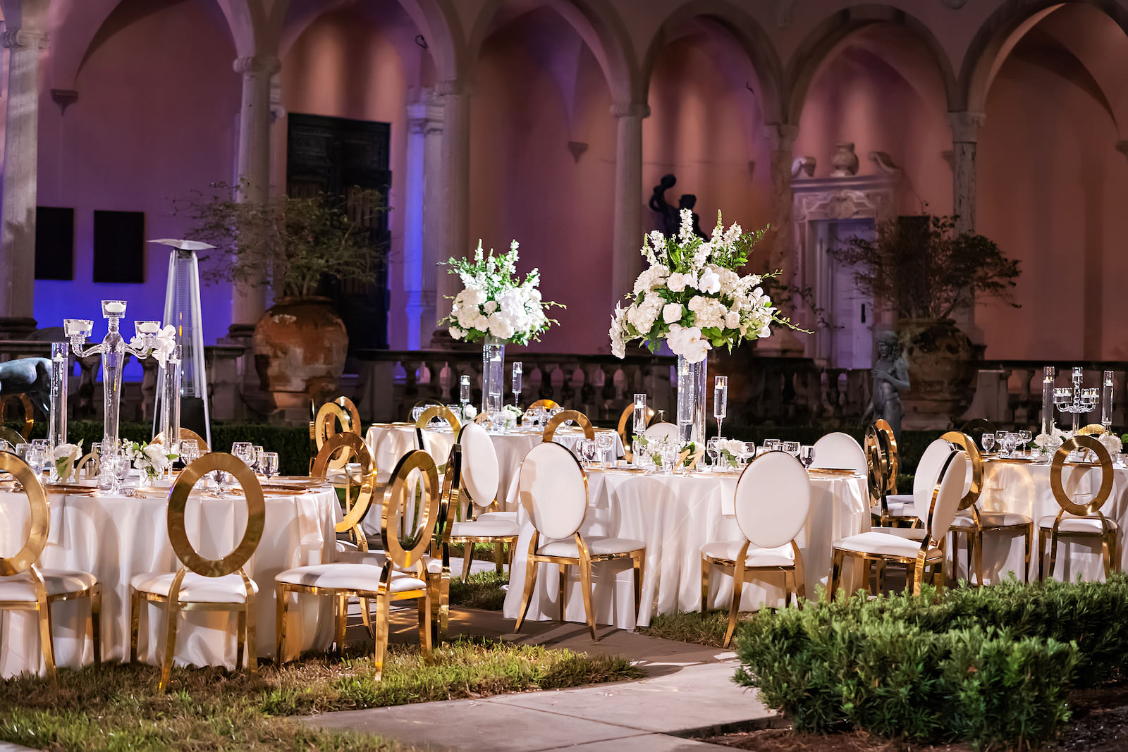 Luxurious Modern Chic Courtyard Wedding Reception Courtyard Wedding Decor, Purple Uplighting, Gold and White Chairs, Black and White Checkered Dance Floor | Tampa Bay Wedding Photographer Limelight Photographer | Sarasota Wedding Venue Ringling Museum