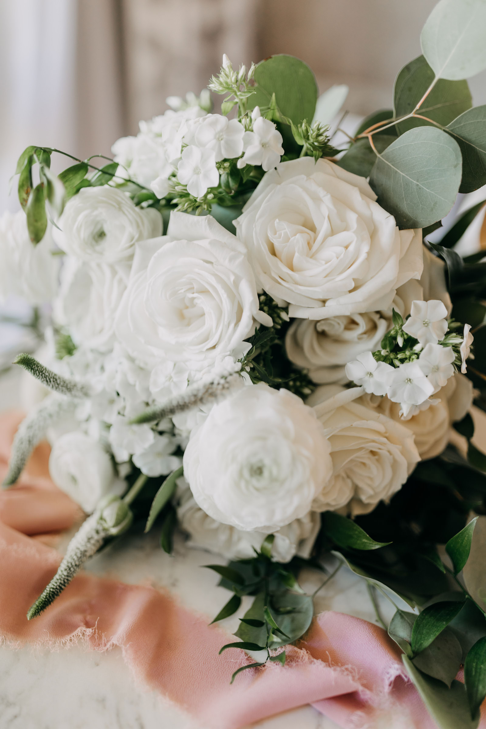 White Roses and Ranunculus Greenery Wedding Bouquet