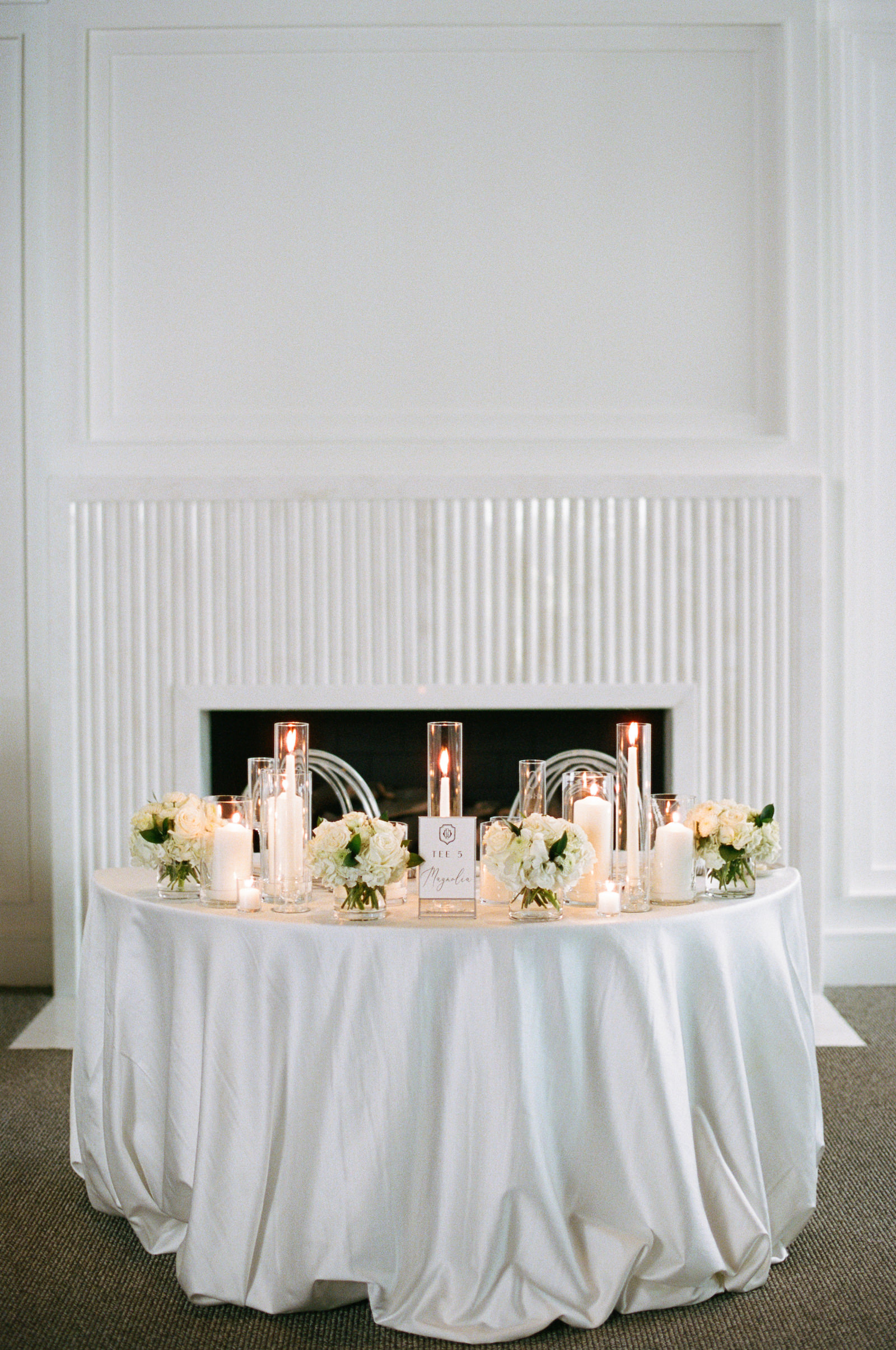 Luxurious Formal All White Wedding Reception Decor, Sweetheart Table with Candles and White Florals | Tampa Bay Wedding Planner Parties A'la Carte | Wedding Florist Bruce Wayne Florals | Wedding Rentals Gabro Event Services