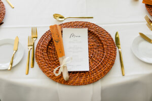 Woven Charger with Gold Flatware with Asian Inspired Fans | Gabro Event Services