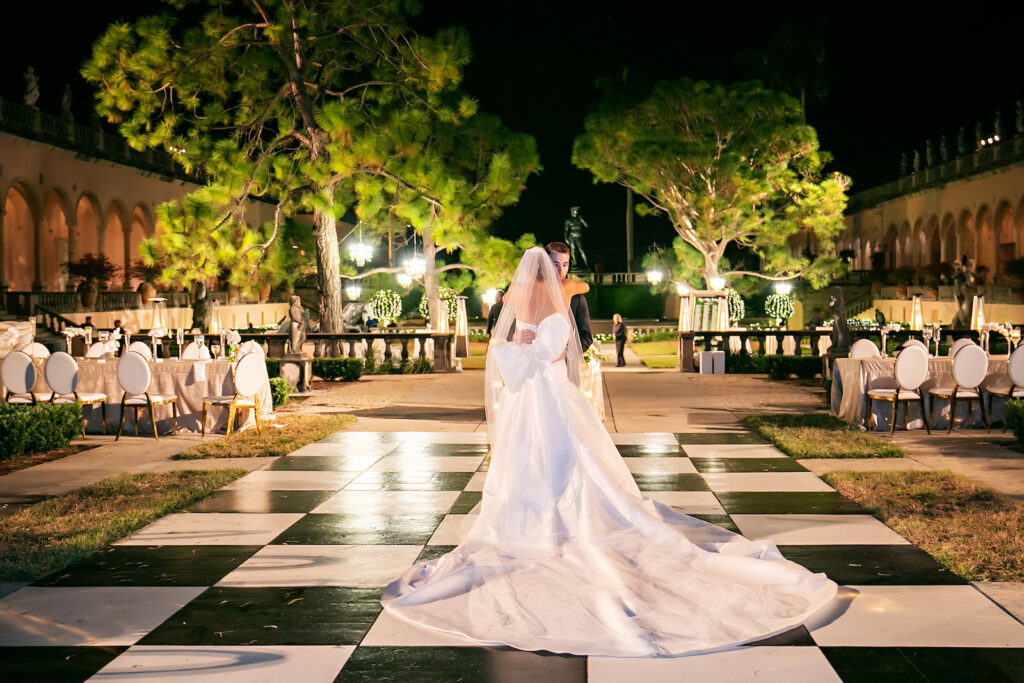 Luxurious Modern Chic Bride and Groom Private Dance on Black and White Checkered Floor | Tampa Bay Wedding Photographer Limelight Photography | Sarasota Wedding Venue Ringling Museum