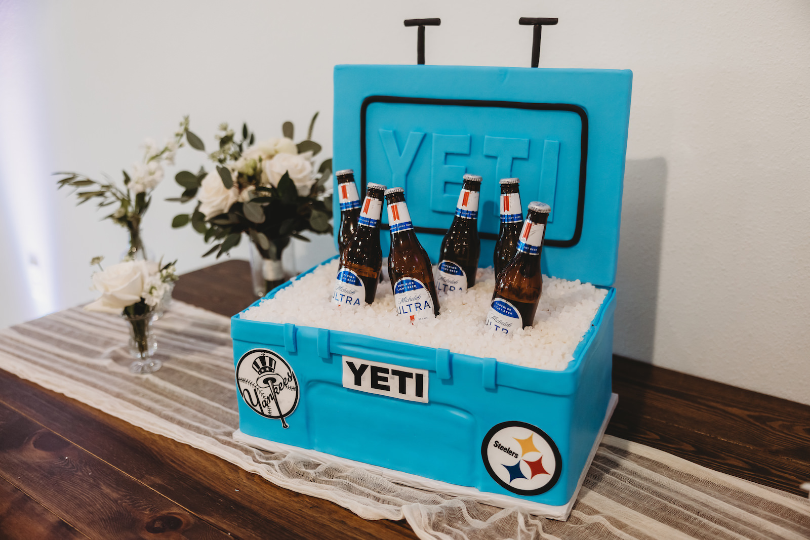 Grooms Wedding Cake, Blue Yeti Cooler with Yankees and Steelers Decor and Beer Bottles
