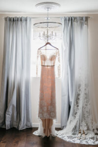Illusion Lace Long Sleeve Wedding Dress with Jeweled Belt on Hanger Wedding Portrait