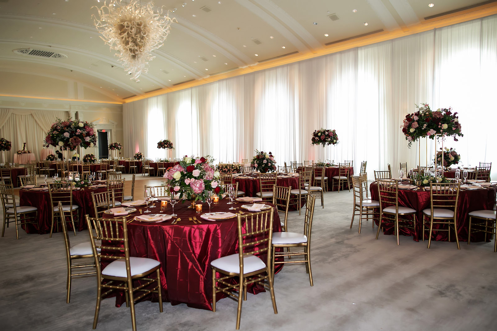 Elegant Garden Burgundy Ballroom Wedding Reception Decor, Red Silk Table Linen, Gold Chiavari Chairs, Gold Stand with Lush Red, Pink and White Roses and Greenery Floral Centerpiece | Tampa Bay Wedding Photographer Limelight Photography | Wedding Florist Lemon Drops | Wedding Planner Breezin Weddings | Wedding Rentals Outside the Box Event Rentals | Vinoy Wedding