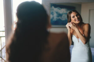 Bride Getting Wedding Ready in Strapless Sweetheart with Lace and Illusion Crepe Fitted Wedding Dress