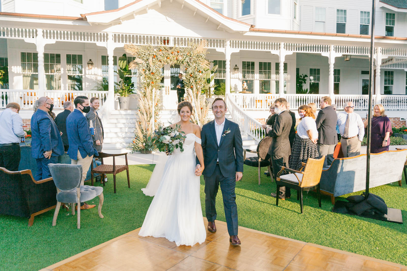 Boho Garden Wedding Ceremony, Bride and Groom Exiting Wedding | Tampa Bay Wedding Planner Parties A'la Carte | Florida Wedding Venue Belleview Inn