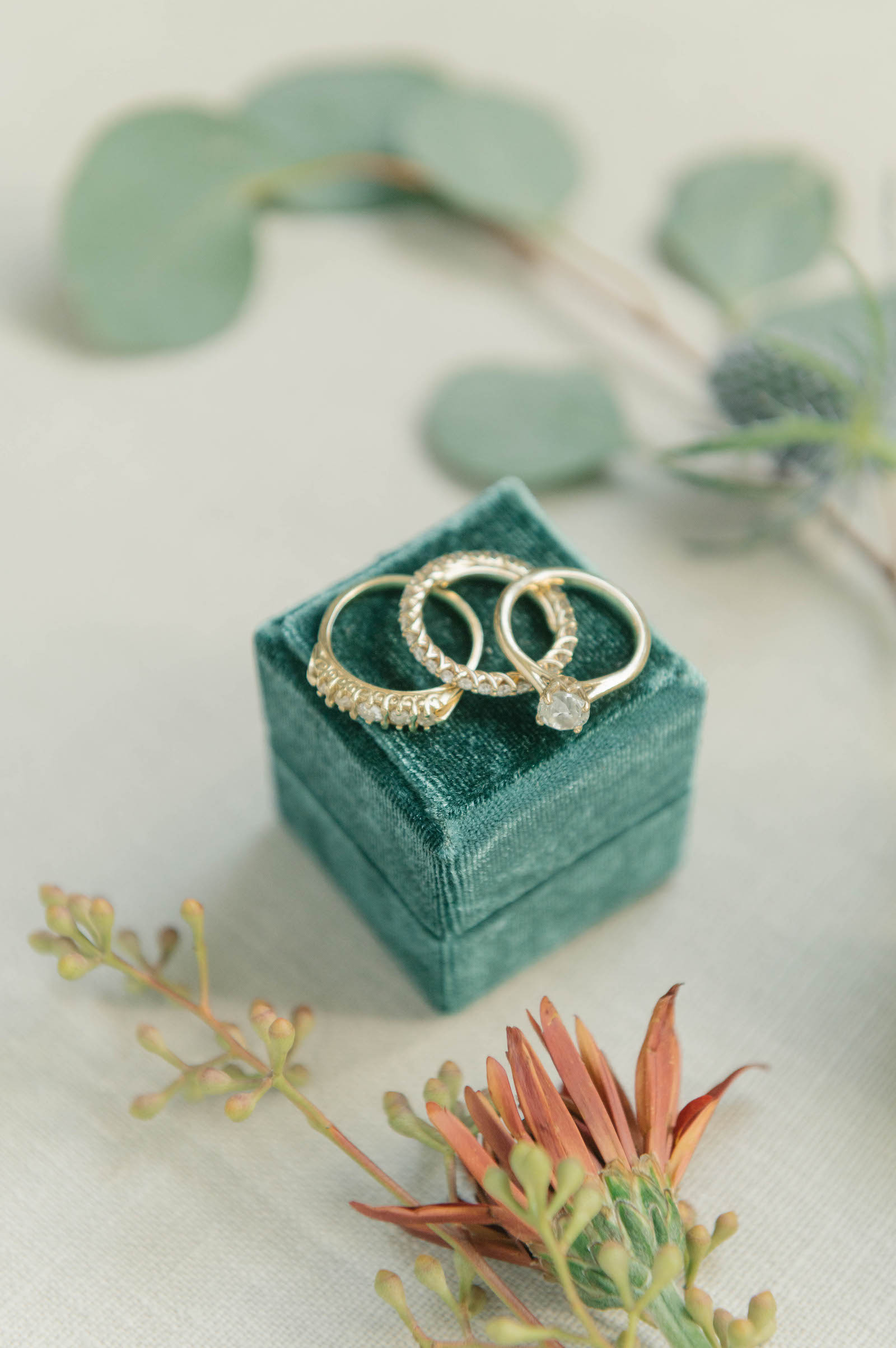 Velvet Teal Ring Box with Yellow Gold Bride Wedding Ring and Solitaire Engagement Ring