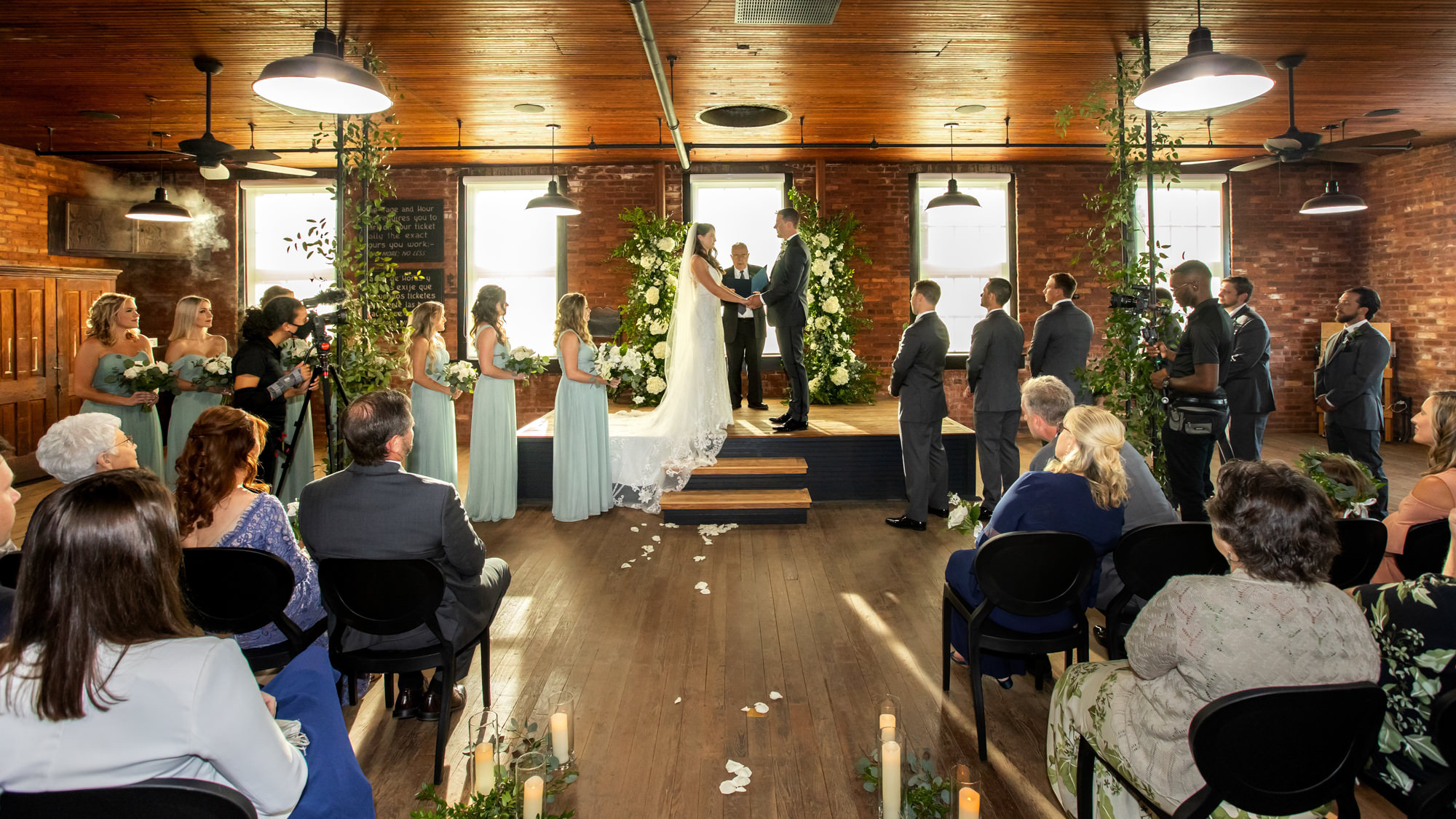 Boho Industrial Ybor-City Wedding Ceremony with Greenery Arch and White Flowers | Venue J.C. Newman Cigar Co.